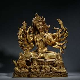 A SINO-TIBETAN BRONZE-GILT WRATHFUL DEITY