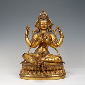 A BRONZE-GILT SEATED BODHISATTVA
