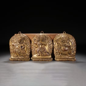 A SET OF THREE BRONZE-GILT VAJRAPANI PLAQUES
