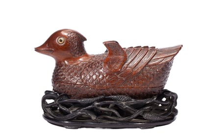 A CARVED HUANGHUALI MANDARIN FORM BOX WITH COVER