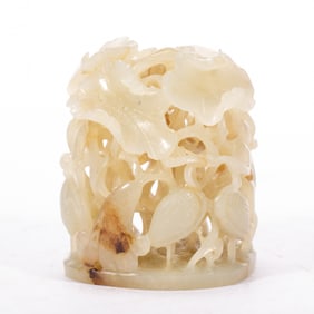 A CARVED WHITE JADE FINIAL