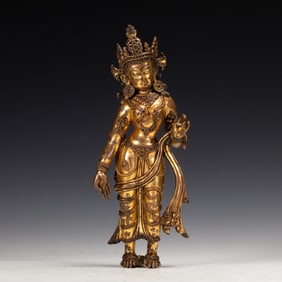 A BRONZE-GILT STANDING BODHISATTVA