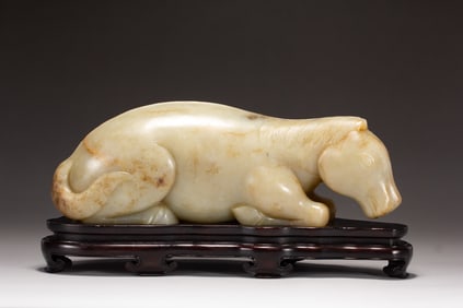 A CARVED WHITE JADE HORSE