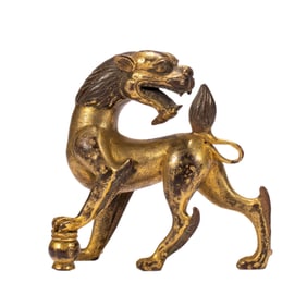 A BRONZE-GILT MYTHICAL BEAST