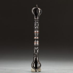 A TIBETAN COPPER INLAID IRON VAJRA