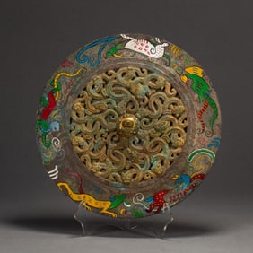 A RARE POLYCHROME PAINTED CIRCULAR MIRROR