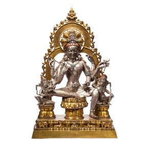 AN EXTREMELY RARE BRONZE-GILT SEATED DEITY WITH RETINUES