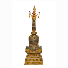 A TIBETAN GOLD AND SILVER PLATED STUPA