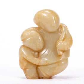 A CARVED JADE BOYS PENDANT