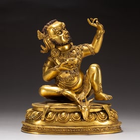 A BRONZE-GILT SIDDHA