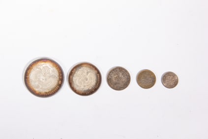 A COLLECTION OF FIVE SILVER COINS