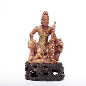 A CARVED SHOUSHAN STONE GUARDIAN