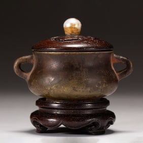 A BRONZE CENSER WITH COVER