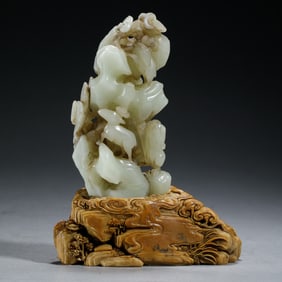 A CARVED WHITE JADE DECORATION