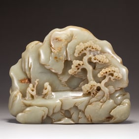 A CARVED WHITE JADE DECORATION