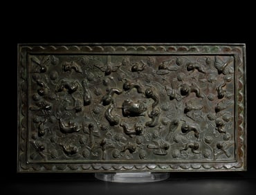 A BRONZE RECTANGULAR MIRROR