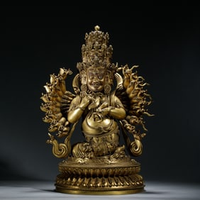 A SINO-TIBETAN BRONZE-GILT WRATHFUL DEITY