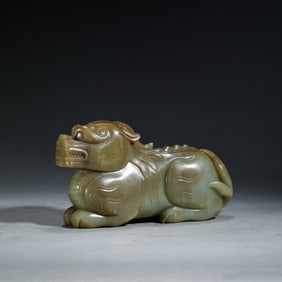 A CARVED JADE MYTHICAL BEAST