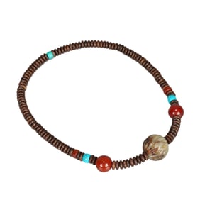 A CARVED JADE BEAD NECKLACE