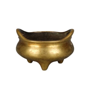 A BRONZE TRIPOD CENSER
