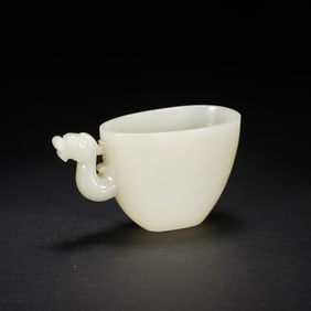 A CARVED WHITE JADE CUP