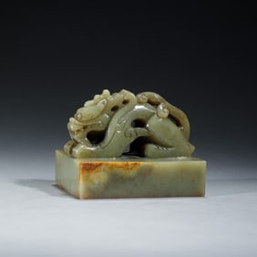 A CARVED JADE DRAGON SEAL