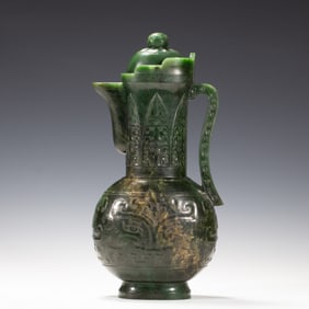 A CARVED SPINACH GREEN JADE EWER