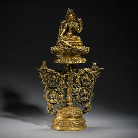A BRONZE-GILT SEATED GREEN TARA