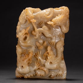 A CARVED WHITE JADE DRAGONS DECORATION