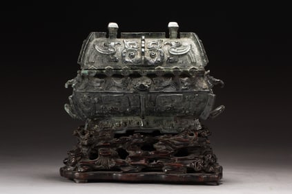 AN IMPORTANT CHINESE ARCHAISTIC BRONZE VESSEL FANGYI