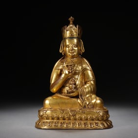 A TIBETAN BRONZE-GILT SEATED MASTER