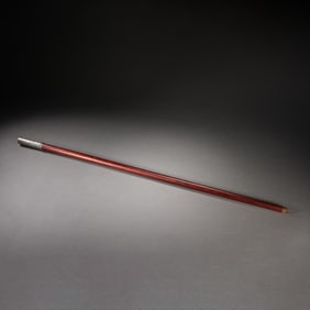 A SILVER INLAID WOODEN WALKING-STICK