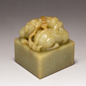 A CARVED JADE LIONS SEAL