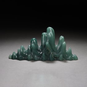 A CARVED STONE MOUNT SHAPE BRUSHREST