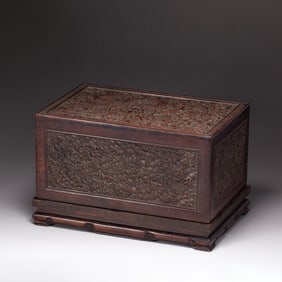 A CARVED ANNATTO B OX WITH COVER