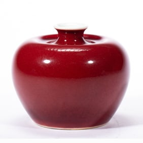 A COPPER RED APPLE-FORM WATERPOT