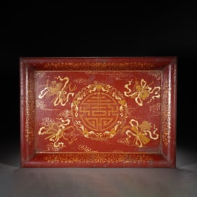 A GOLD PAINTED LACQUER AUSPICIOUS SYMBOLS TEA TRAY