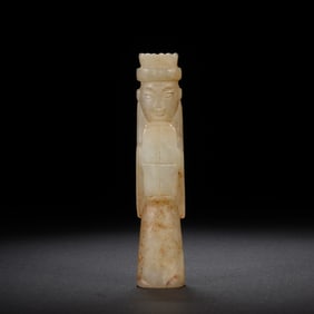 A CARVED JADE FIGURE