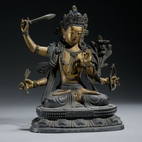 A SINO-TIBETAN BRONZE SEATED BODHISATTVA
