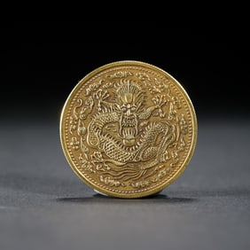 A SILVER-GILT COIN