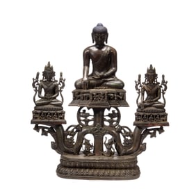 A COPPER-ALLOY SEATED SHAKYAMUNI WITH ACOLYTES