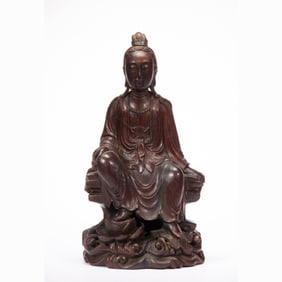 A CARVED ALOESWOOD CHENXIANG SEATED GUANYIN