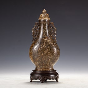 A CARVED JADE VASE WITH COVER