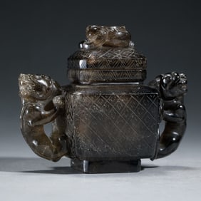 A CARVED SMOKY QUARTZ INCENSE BURNER