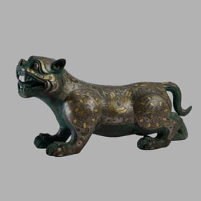A GOLD AND SILVER DECORATED BRONZE FELINE