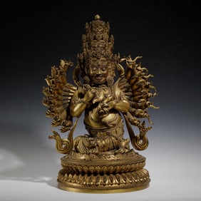 A BRONZE-GILT MULTI-ARMS PROTECTOR