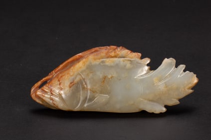 A CARVED WHITE JADE FISH