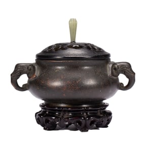 A BRONZE CENSER WITH HANDLES