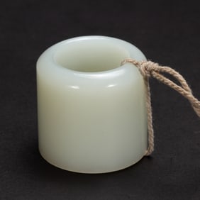 A WHITE JADE ARCHER RING