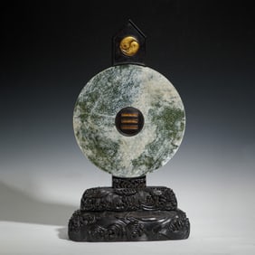A CHINESE JADE DISC BI